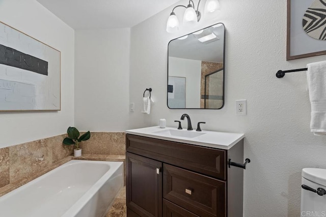 full bathroom with a bath, toilet, and vanity