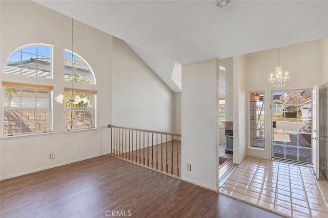 6118 Landau Pl, Quartz Hill, CA 93536 - foyer featuring a chandelier, wood finished floors, and a high ceiling