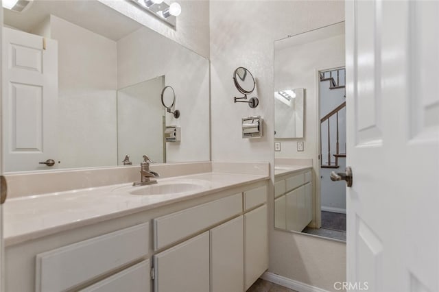 bathroom featuring vanity and baseboards