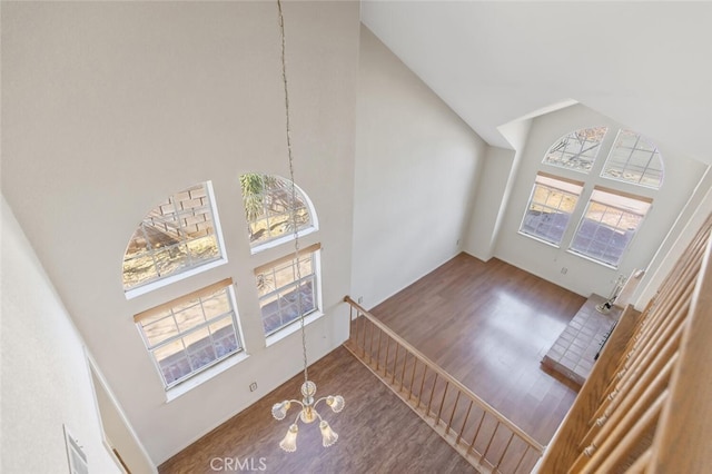6118 Landau Pl, Quartz Hill, CA 93536 - unfurnished living room with high vaulted ceiling, wood finished floors, and a chandelier