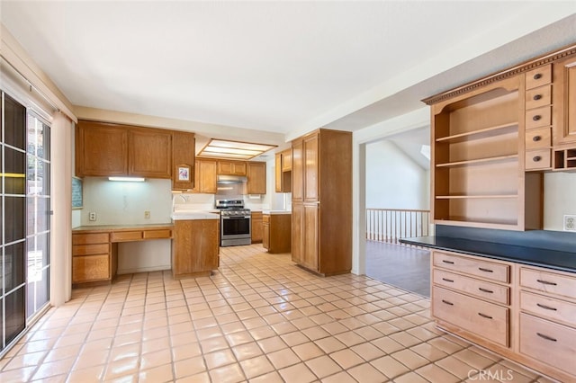 6118 Landau Pl, Quartz Hill, CA 93536 - kitchen featuring stainless steel stove, under cabinet range hood, light countertops, light tile patterned floors, and open shelves
