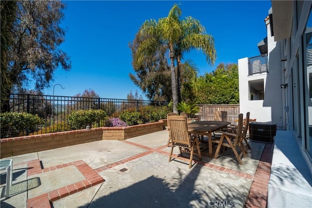 view of patio / terrace featuring outdoor dining area and a fenced backyard