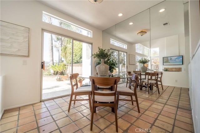 dining space with light tile patterned floors, recessed lighting, and visible vents