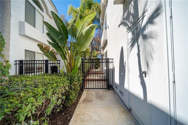 view of gate with fence