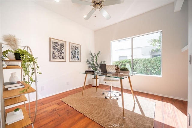 office with baseboards, a ceiling fan, and wood finished floors