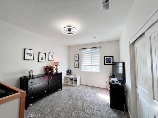 bedroom featuring carpet, a closet, visible vents, and baseboards