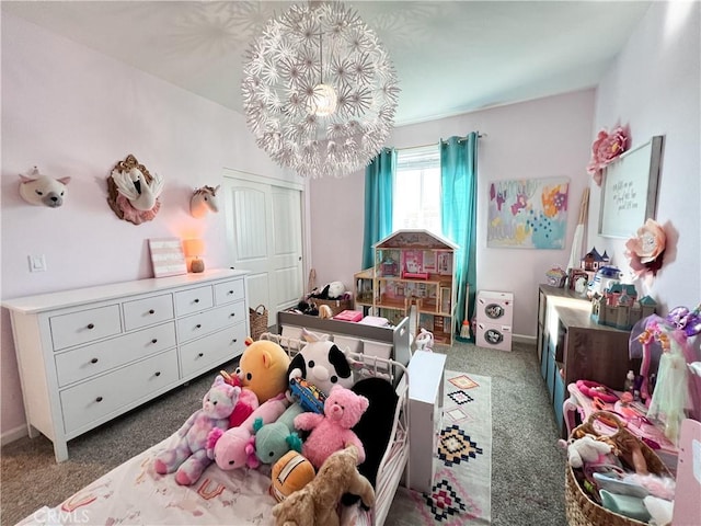 carpeted bedroom with baseboards and a notable chandelier