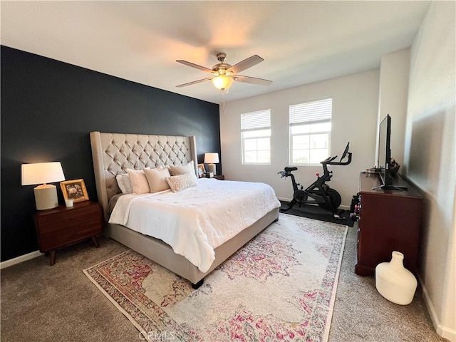 carpeted bedroom featuring ceiling fan and baseboards