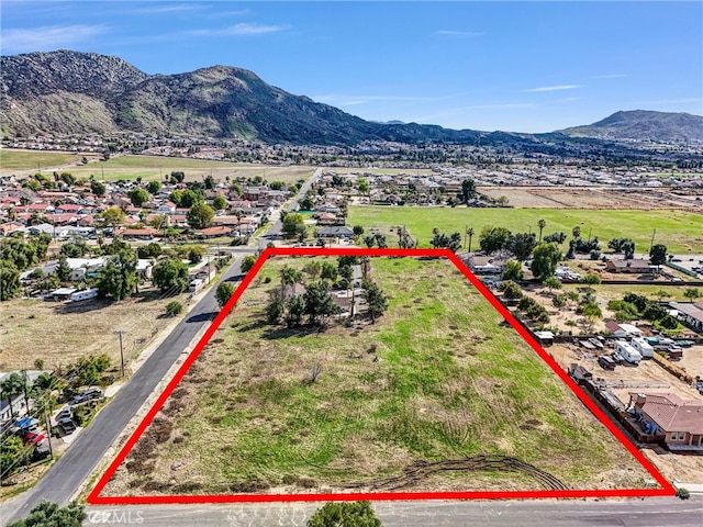 birds eye view of property with a mountain view