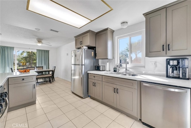 kitchen featuring plenty of natural light, visible vents, appliances with stainless steel finishes, and a sink