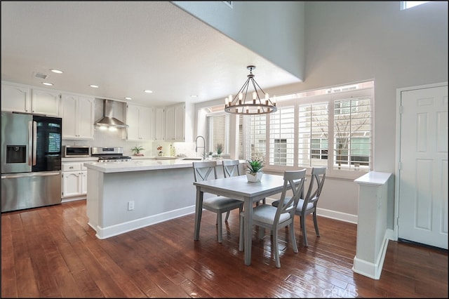 dining space with visible vents, dark wood-type flooring, recessed lighting, baseboards, and a chandelier