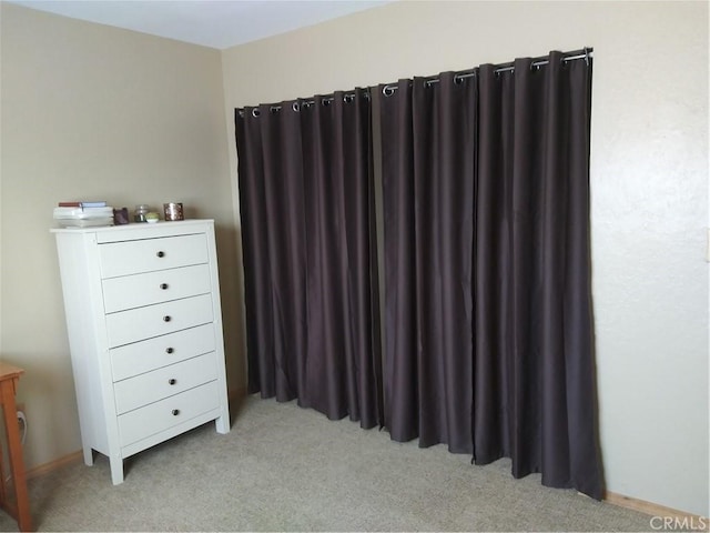 bedroom with light colored carpet