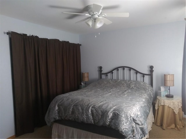 bedroom featuring carpet and a ceiling fan