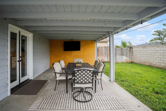 view of patio / terrace featuring outdoor dining space and fence