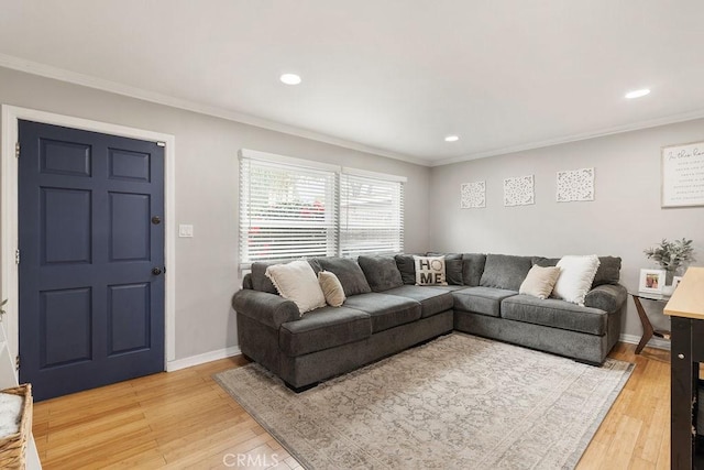 living area with crown molding, recessed lighting, baseboards, and light wood-type flooring