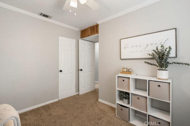 bedroom featuring visible vents, baseboards, carpet, and ornamental molding