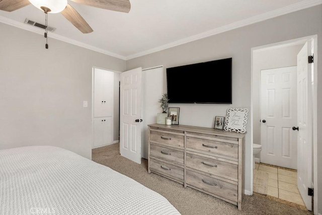 bedroom with visible vents, light colored carpet, a ceiling fan, and ornamental molding