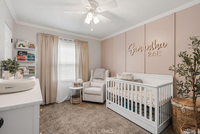 bedroom featuring ceiling fan, a crib, a sink, crown molding, and carpet flooring