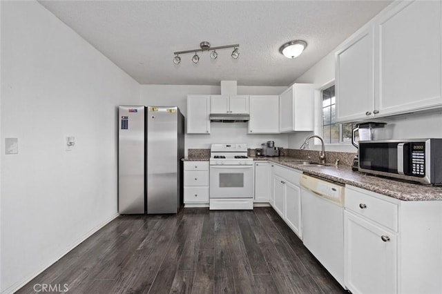 kitchen featuring dark wood-style floors, stainless steel appliances, under cabinet range hood, white cabinetry, and a sink