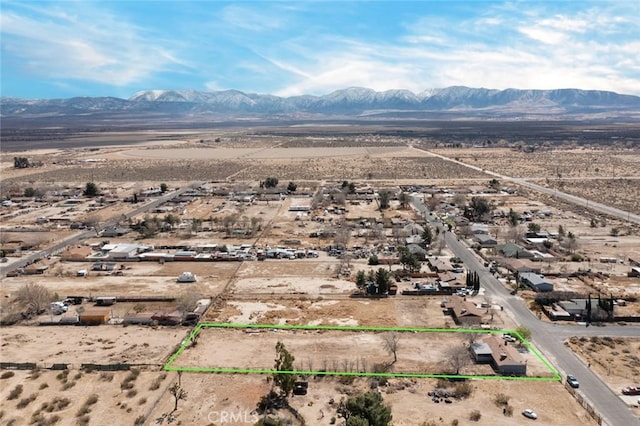 bird's eye view featuring a mountain view, a desert view, and a rural view