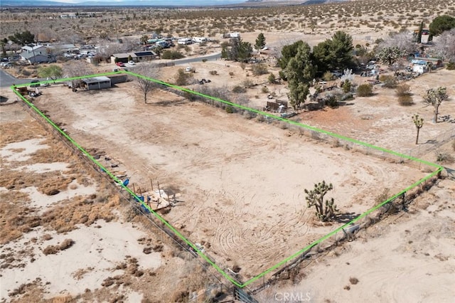 aerial view featuring view of desert, a rural view, and a mountain view