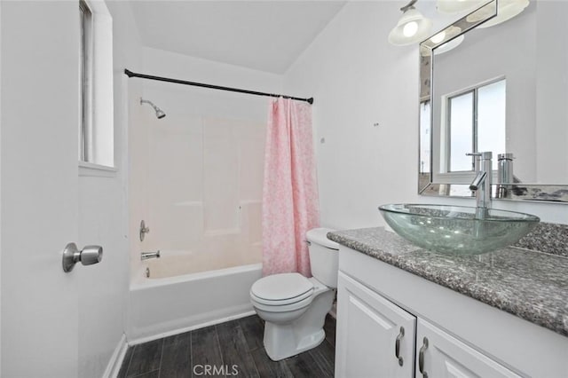 bathroom featuring vanity, shower / bath combo with shower curtain, wood finished floors, and toilet