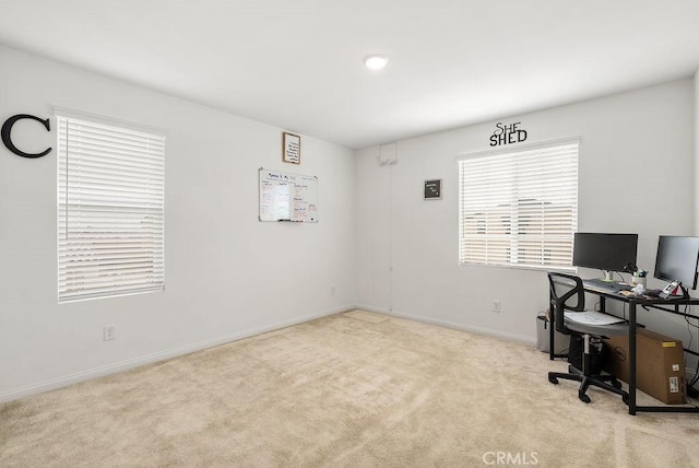 carpeted office with baseboards