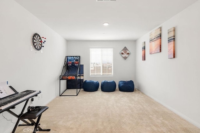 interior space featuring visible vents, baseboards, and carpet flooring