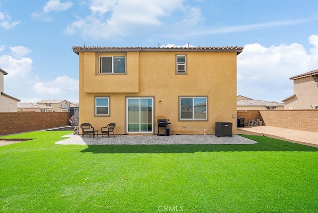 back of house featuring a patio area, a fenced backyard, and stucco siding