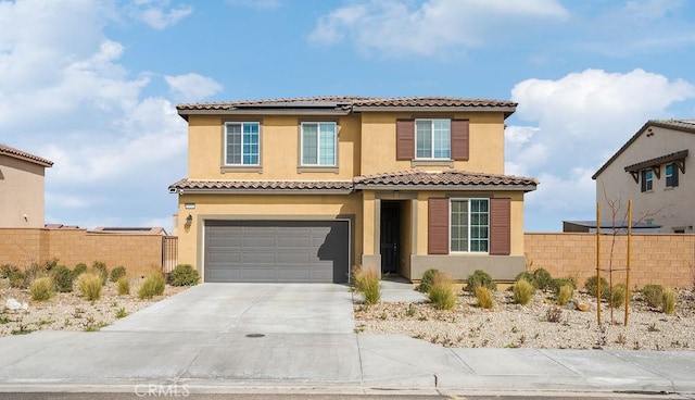 mediterranean / spanish home featuring driveway, an attached garage, fence, roof mounted solar panels, and stucco siding