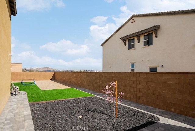 view of yard featuring a fenced backyard and a patio