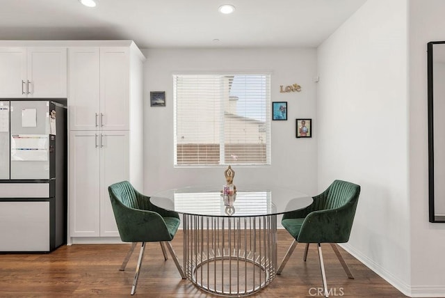 dining room featuring dark wood-type flooring, recessed lighting, and baseboards