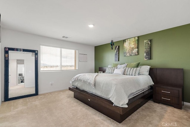 bedroom with light carpet, baseboards, and visible vents