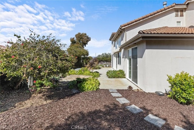 view of yard with a patio and fence