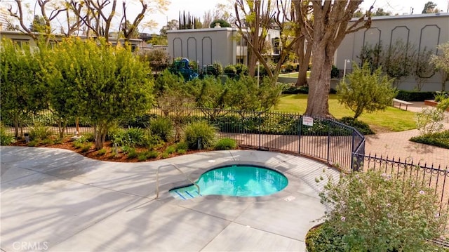 view of pool featuring fence