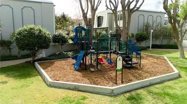 community jungle gym with a lawn