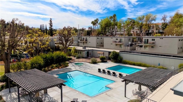 community pool with a patio area