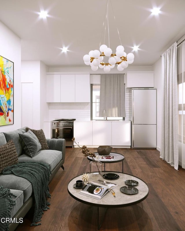 living area with dark wood finished floors and an inviting chandelier