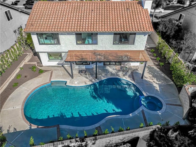 view of swimming pool with a patio and a fenced in pool