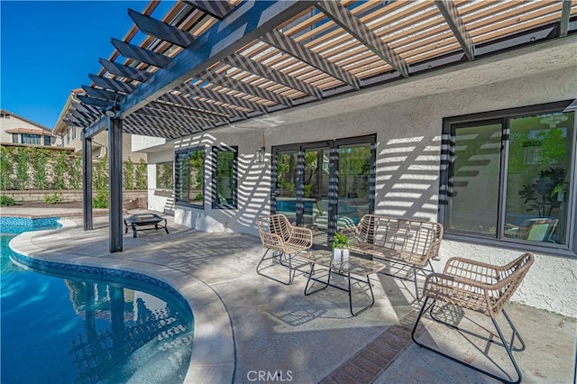 view of patio featuring an outdoor pool and an outdoor fire pit