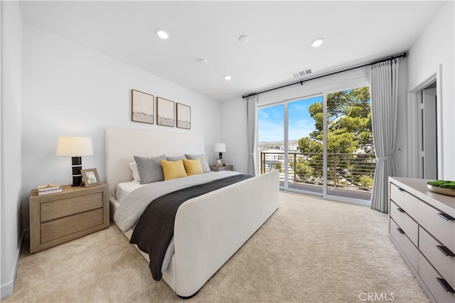 bedroom with recessed lighting, visible vents, light colored carpet, and access to exterior