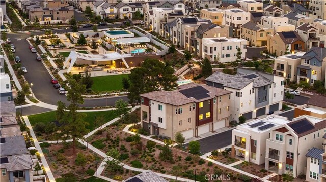 birds eye view of property with a residential view