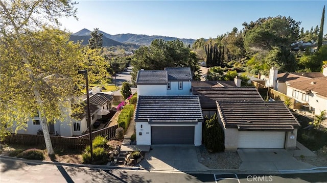 birds eye view of property with a mountain view