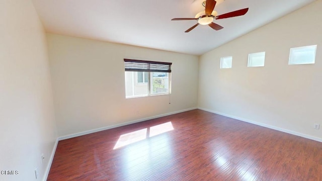 unfurnished room with a ceiling fan, baseboards, lofted ceiling, and wood finished floors