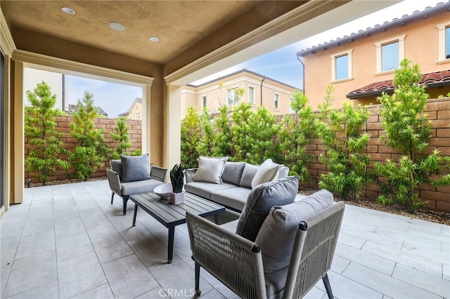 view of patio featuring a fenced backyard and outdoor lounge area