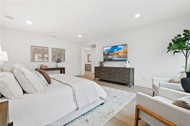 bedroom featuring recessed lighting, baseboards, and light wood-style floors