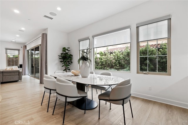 dining room featuring recessed lighting, visible vents, baseboards, and light wood finished floors