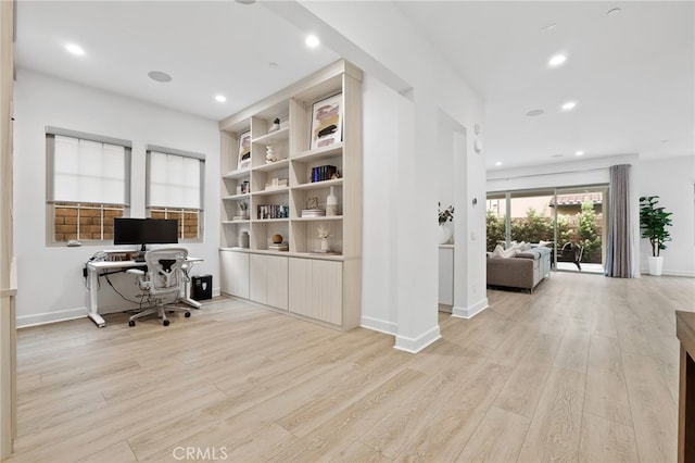 home office featuring recessed lighting, baseboards, and light wood finished floors