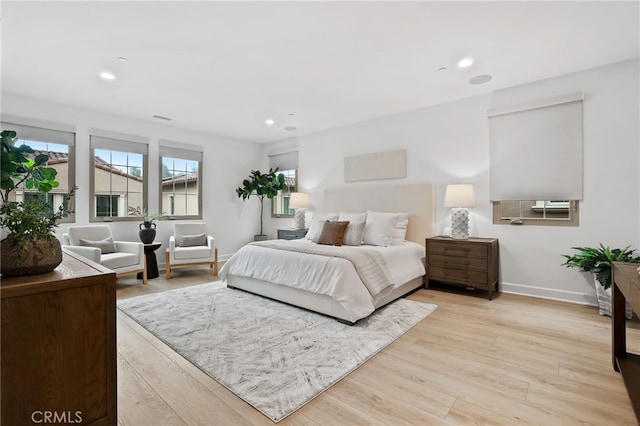 bedroom with visible vents, recessed lighting, light wood-style floors, and baseboards