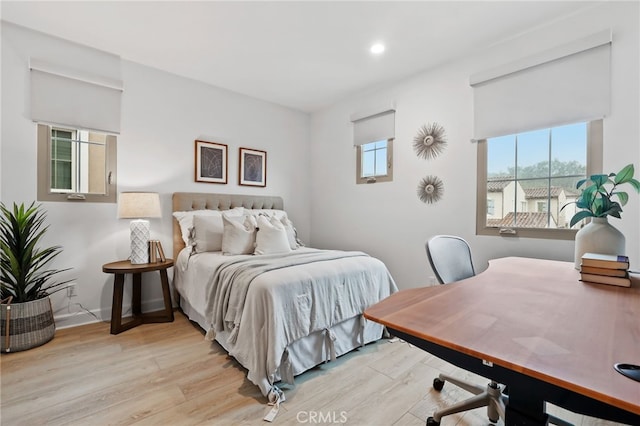 bedroom featuring recessed lighting, wood finished floors, and baseboards